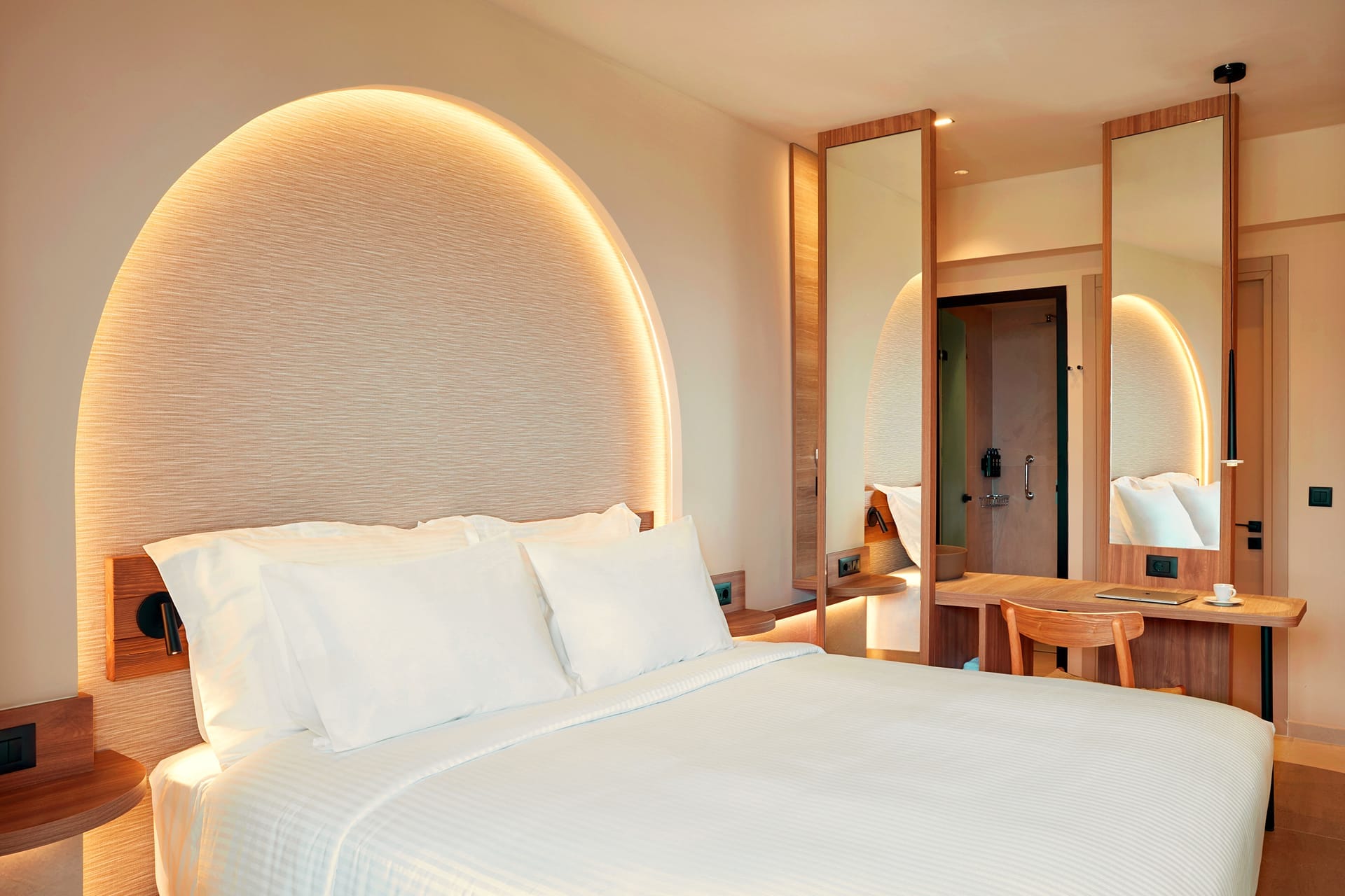 a bed with a large headboard