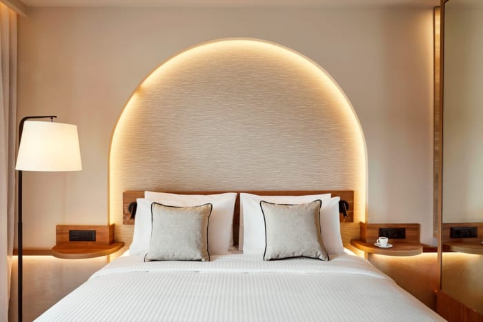 a bed with a white bed spread