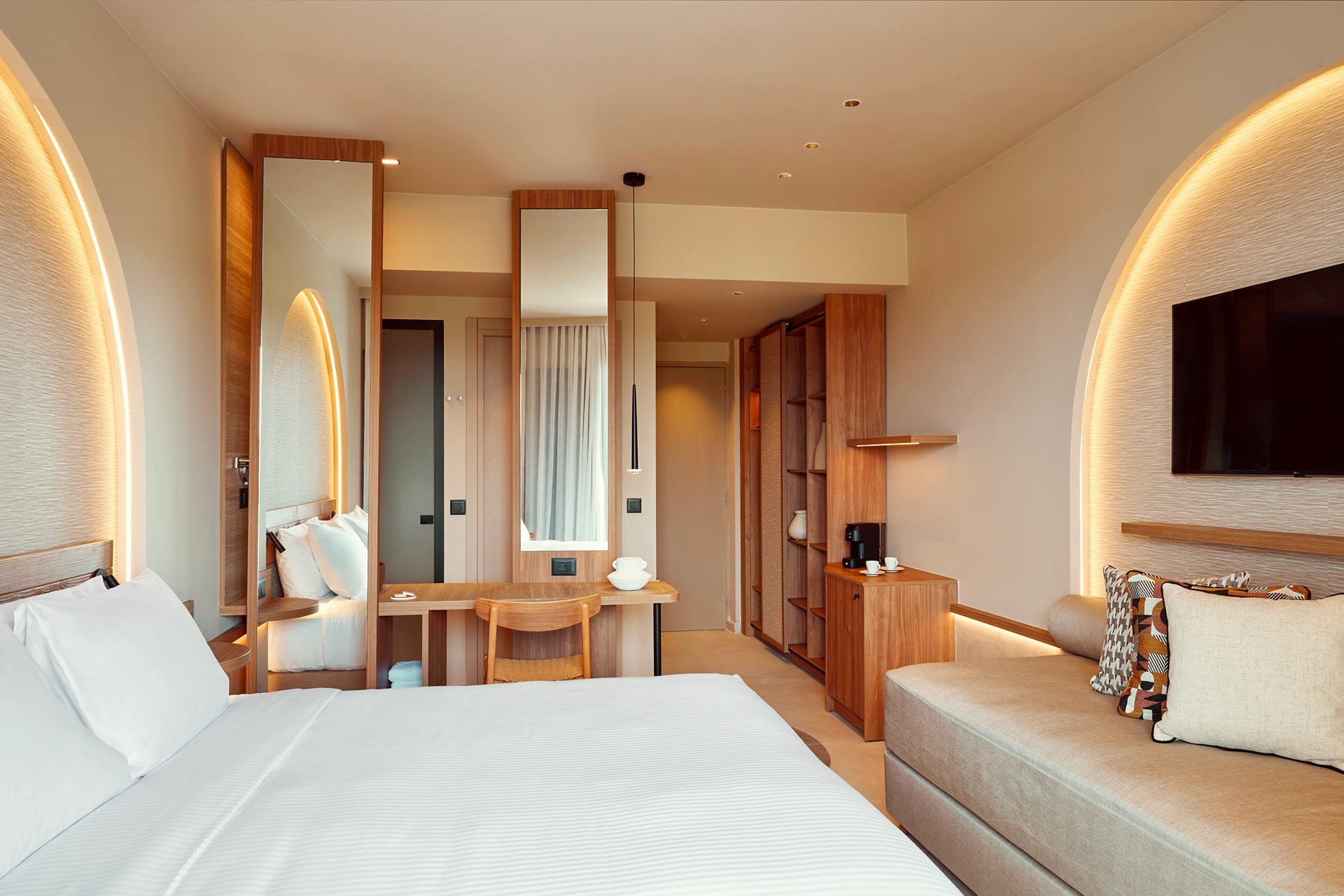 a hotel room with a bed and a couch