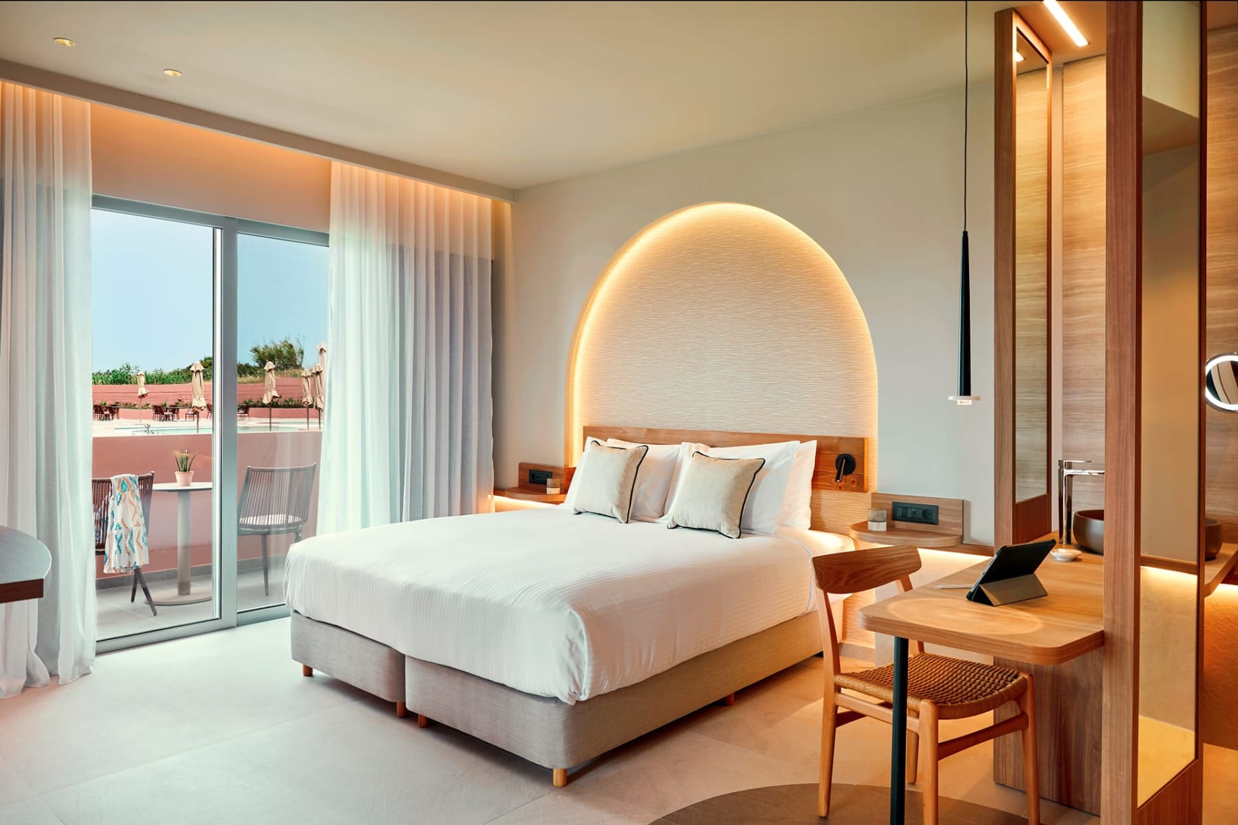 a hotel room with a large bed