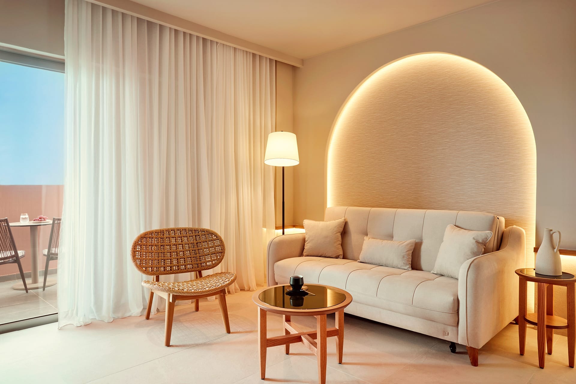 a living room with a white couch and a table