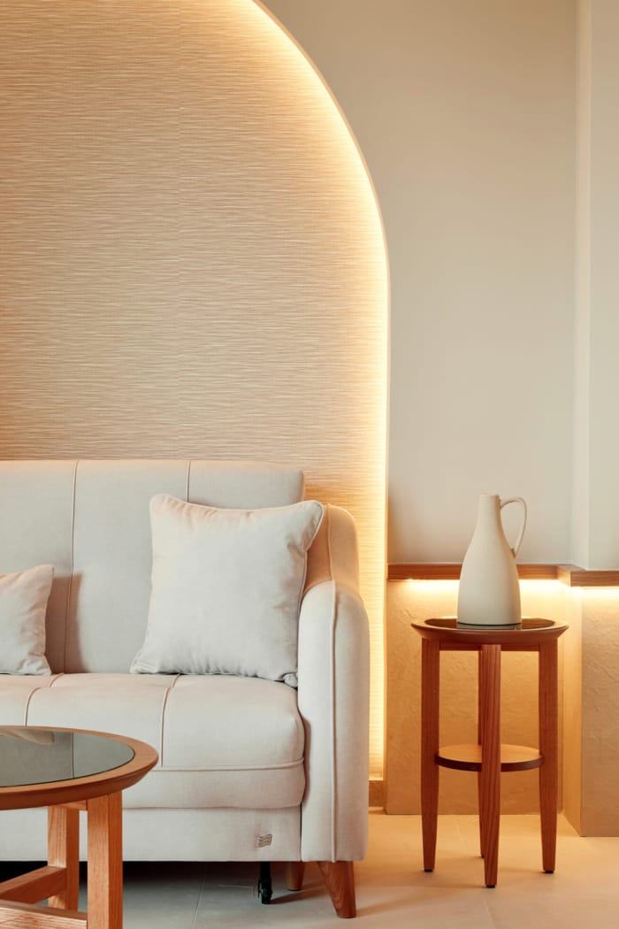 a white couch and a table