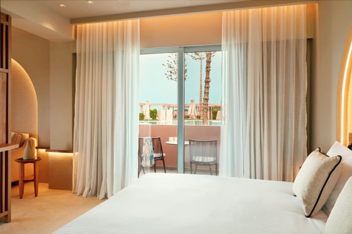 a bedroom with a large window