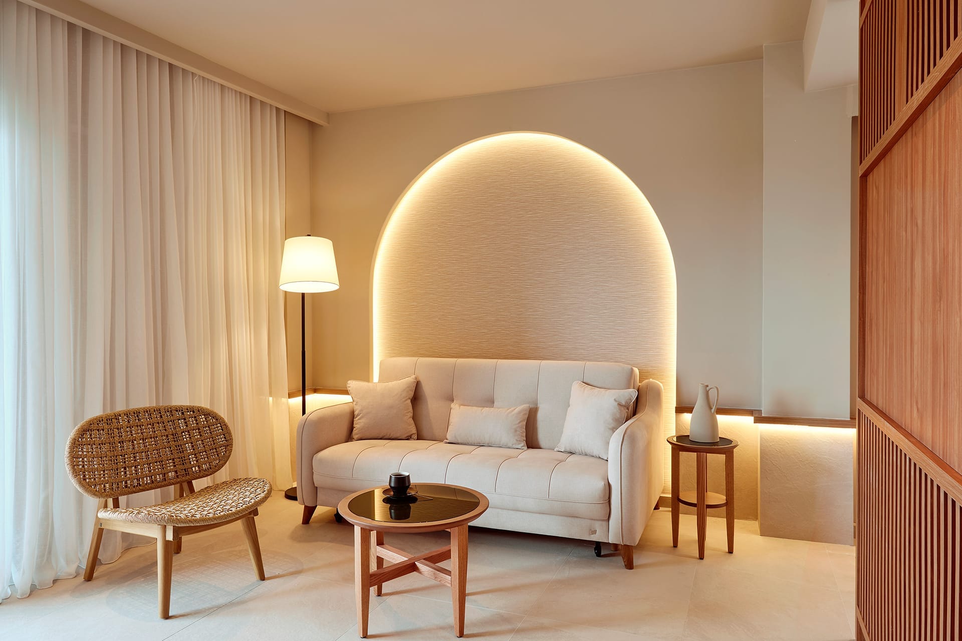 a living room with a white couch and a table