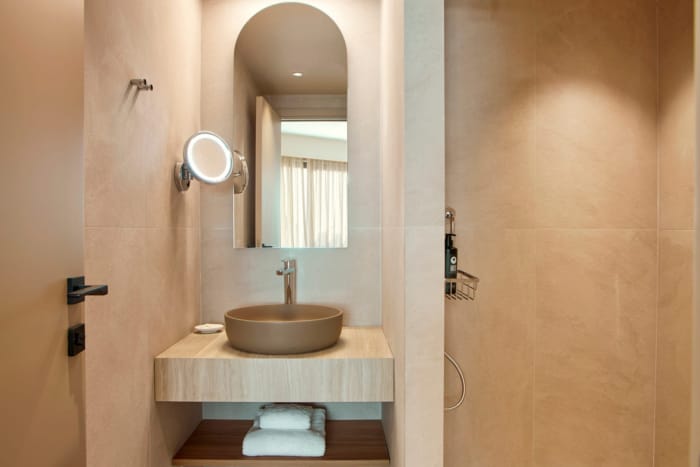 a bathroom with a sink and mirror