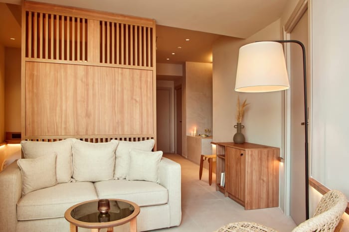 a living room with a white couch and a table