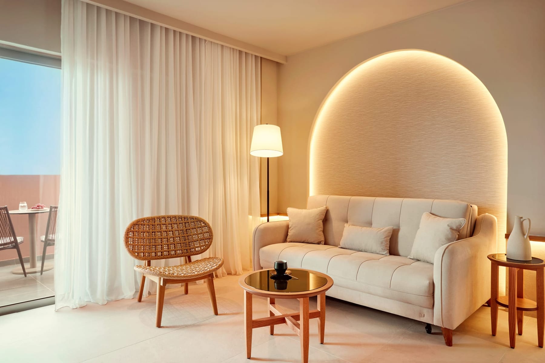 a living room with a white couch and a table