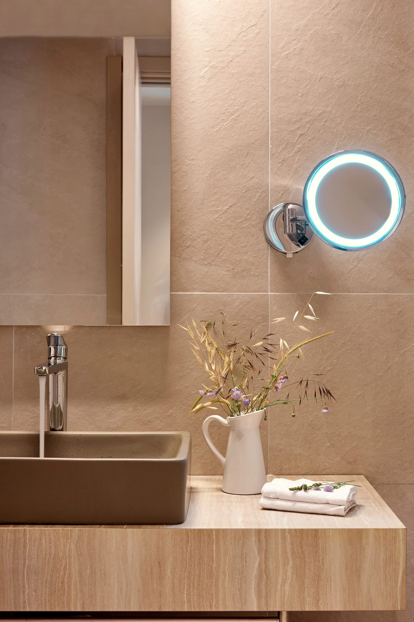 a vase with flowers on a counter