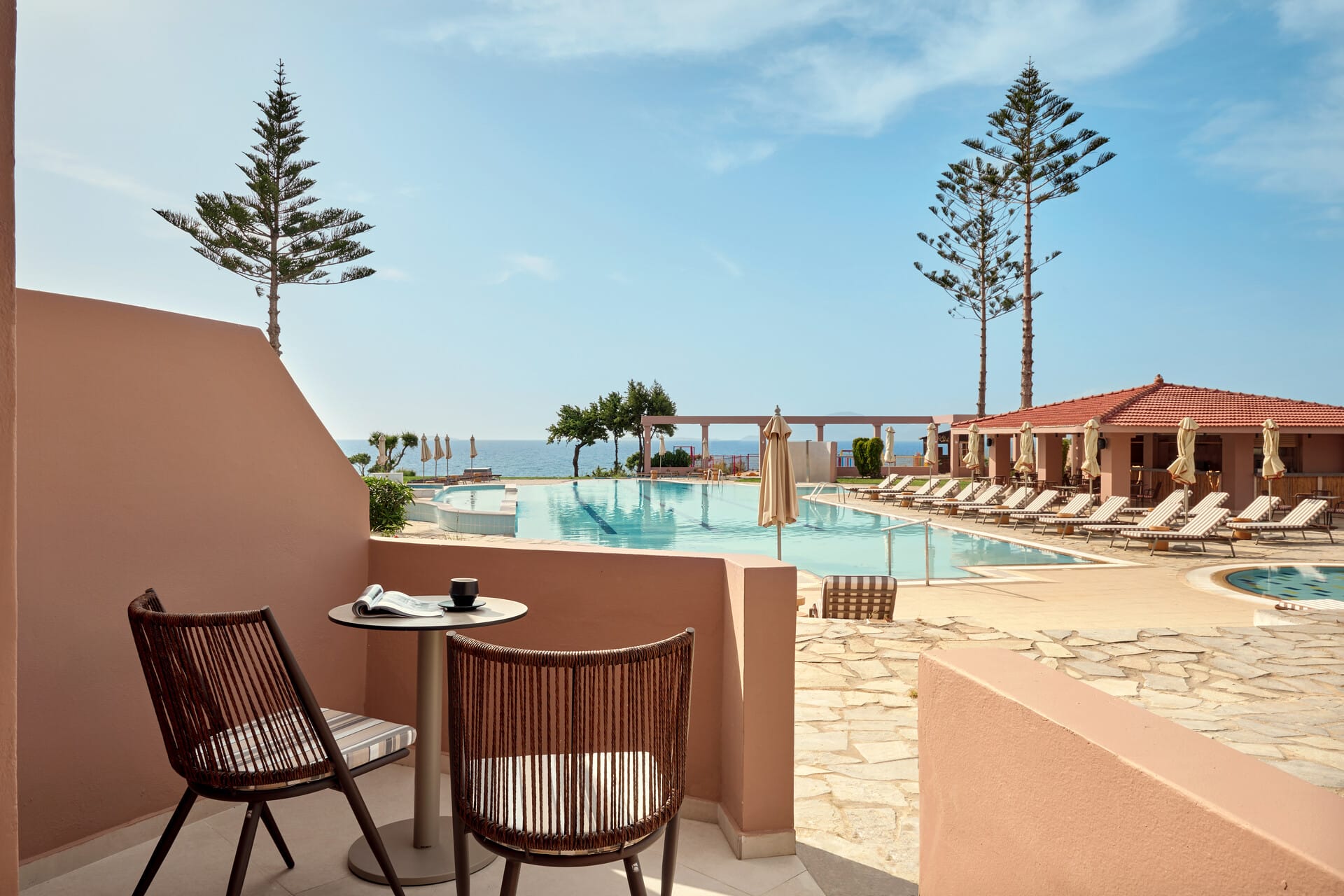 a pool with chairs and a table