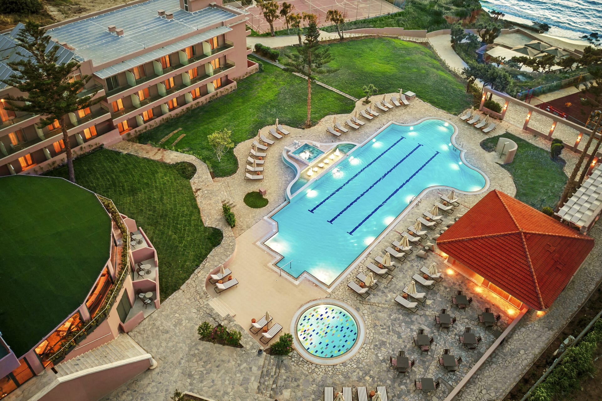 a swimming pool with a building in the background