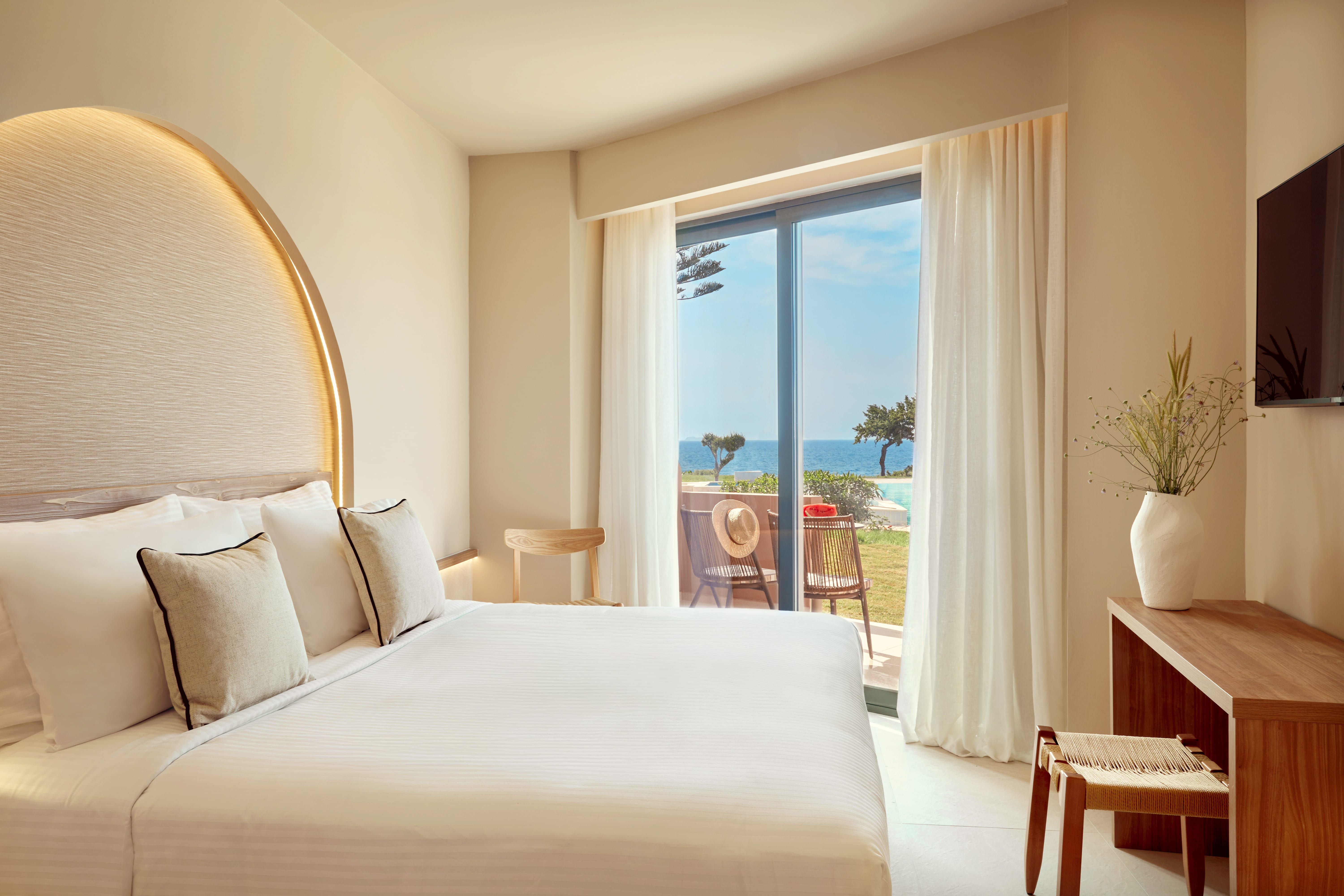 a bedroom with a large window