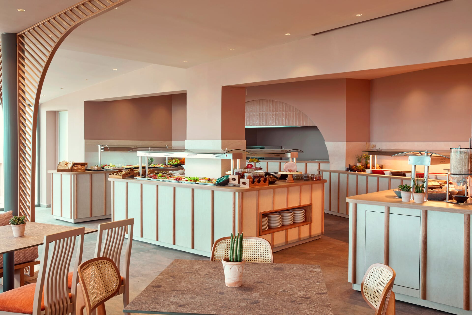 a kitchen with a bar and chairs