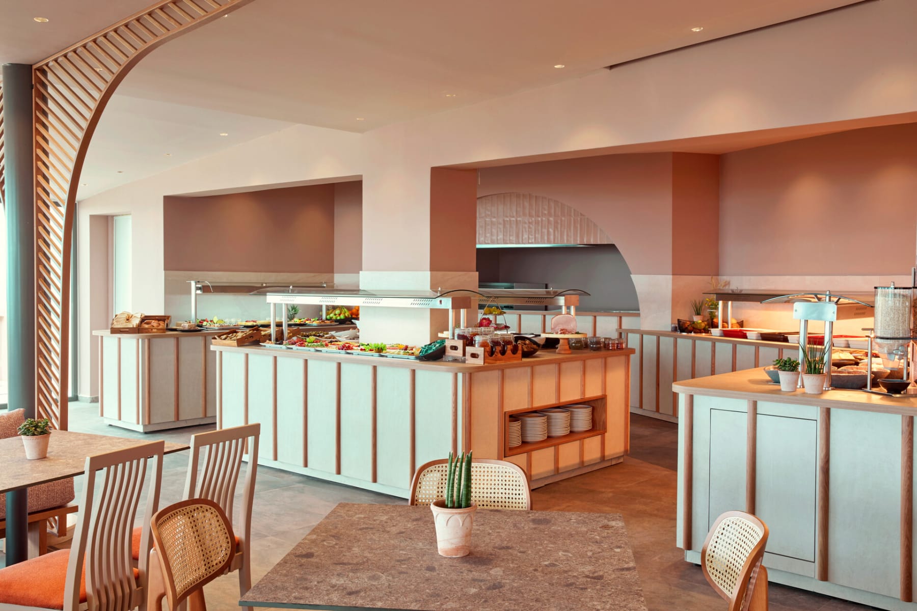 a kitchen with a bar and chairs