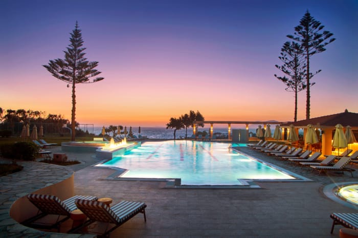 a pool with chairs around it