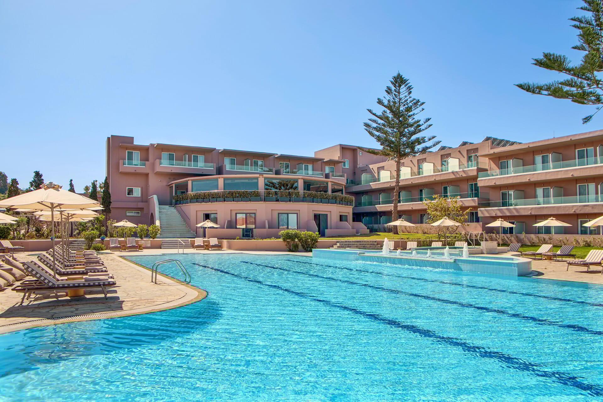 a swimming pool in front of a building