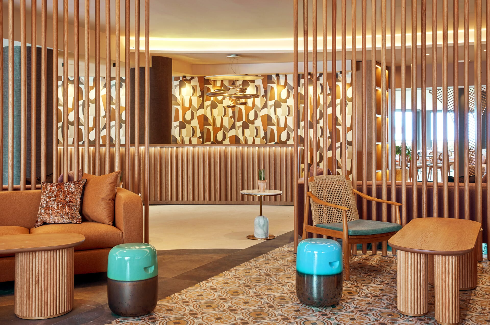 a room with a couch and chairs