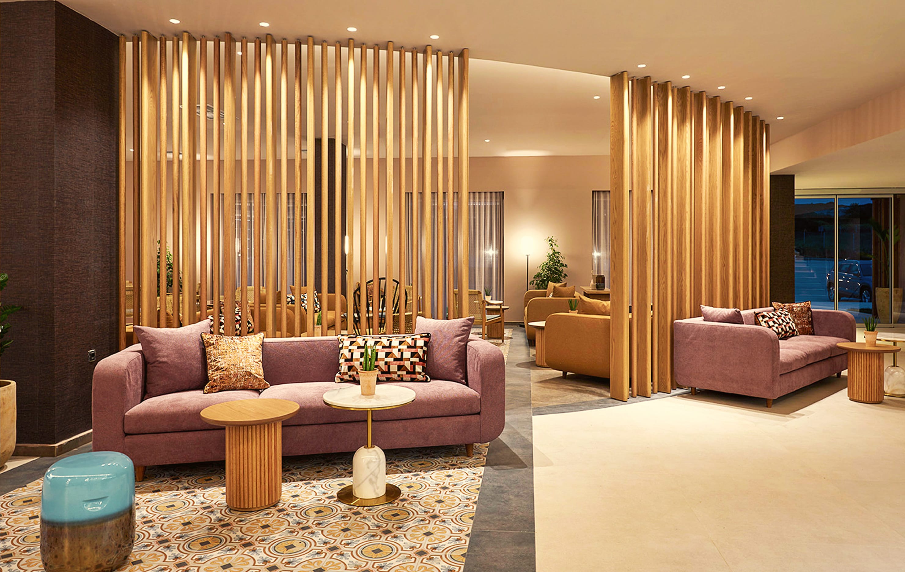 a living room with a pink couch