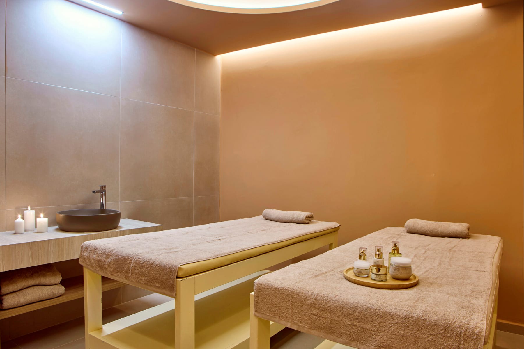 a bathroom with a bed and a sink
