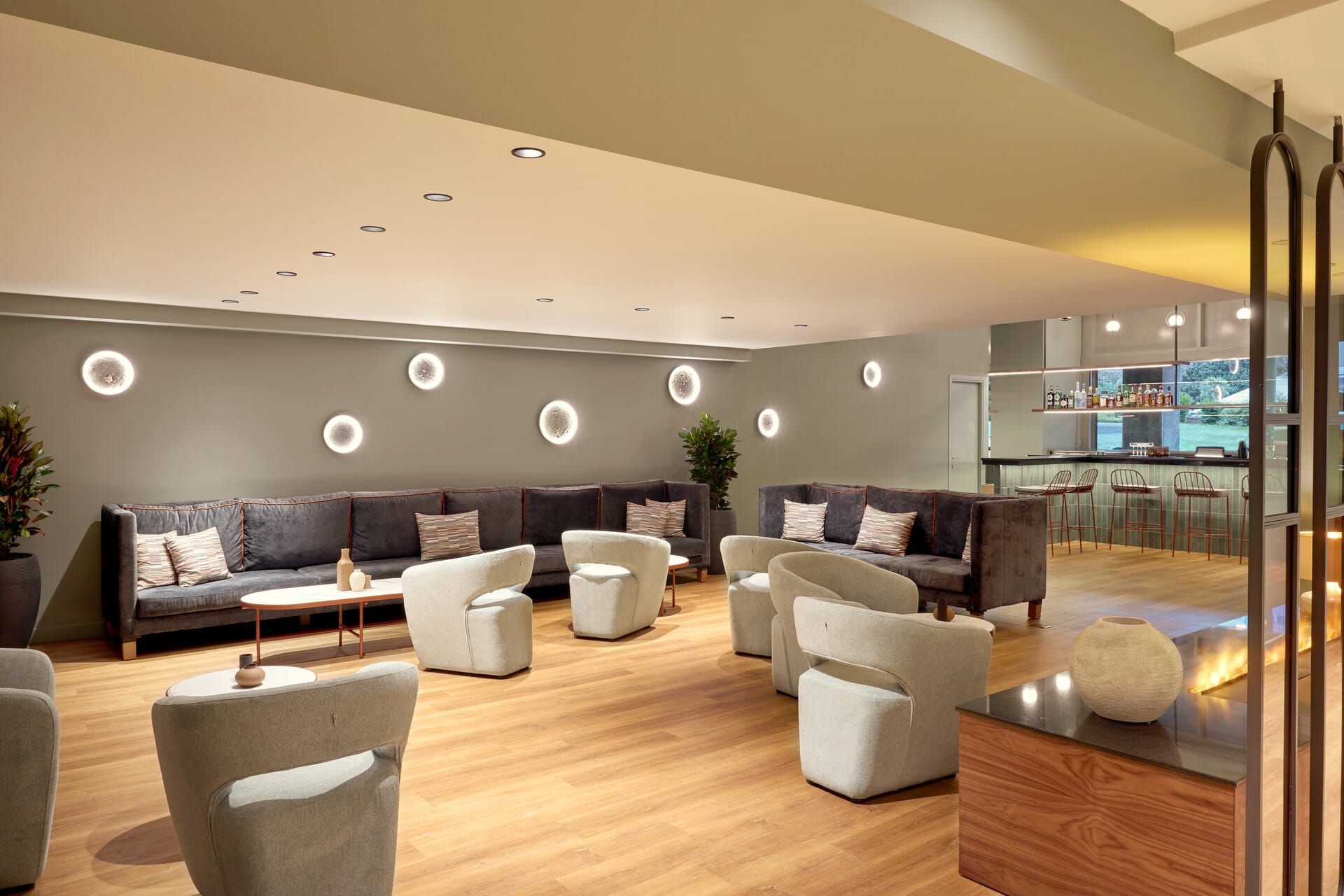 a room with a couch and chairs