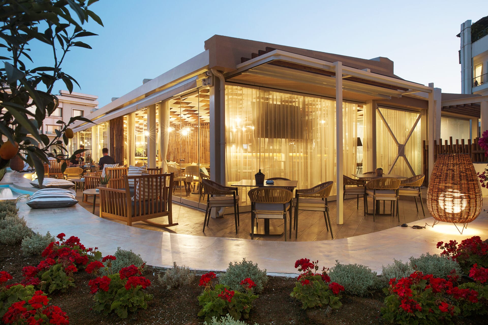 a house with a pool and chairs