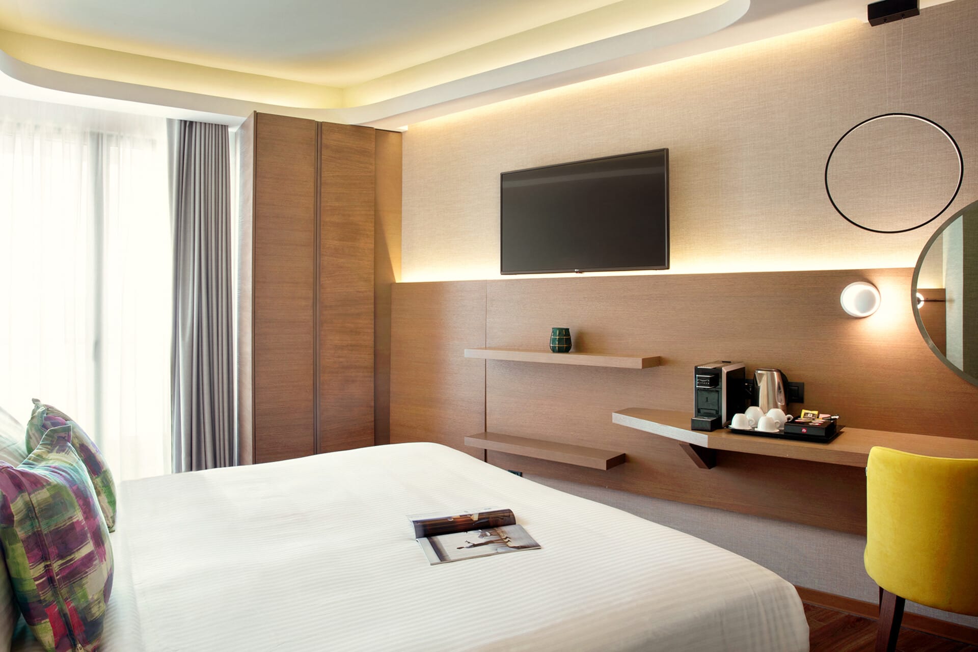 a room with a bed and a tv