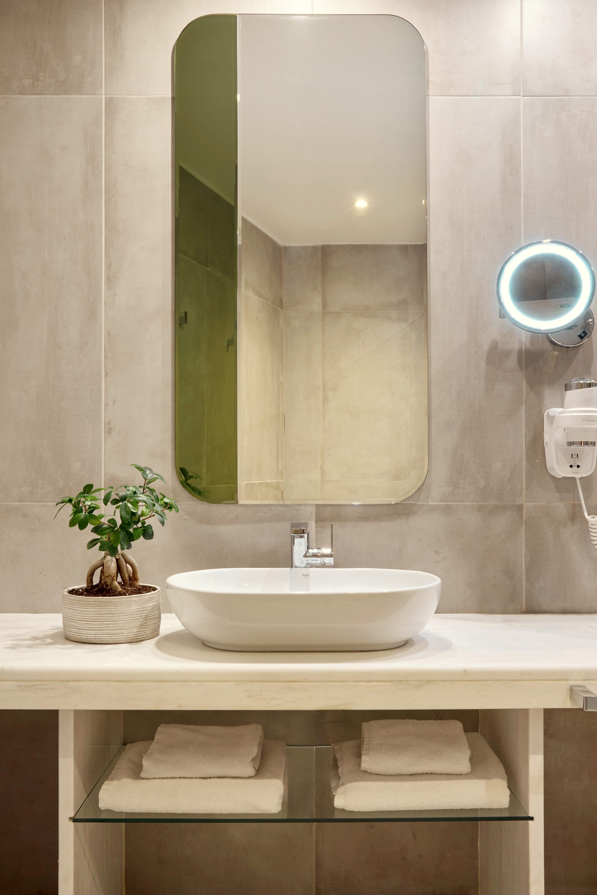 a bathroom with a large mirror