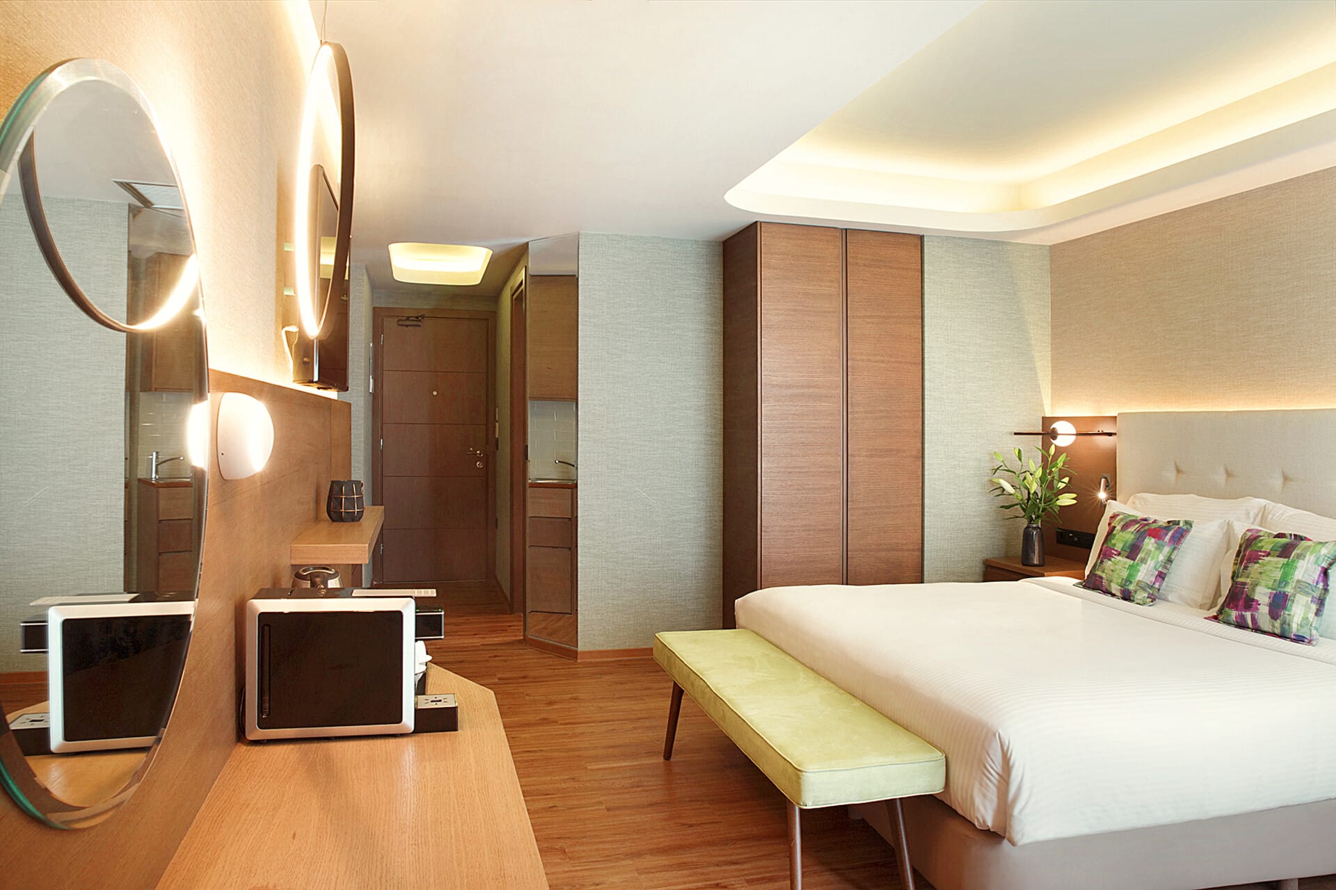 a bedroom with a bed and a television