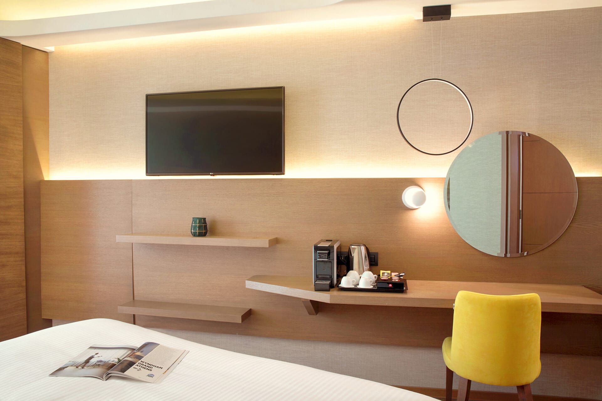 a room with a desk and a television