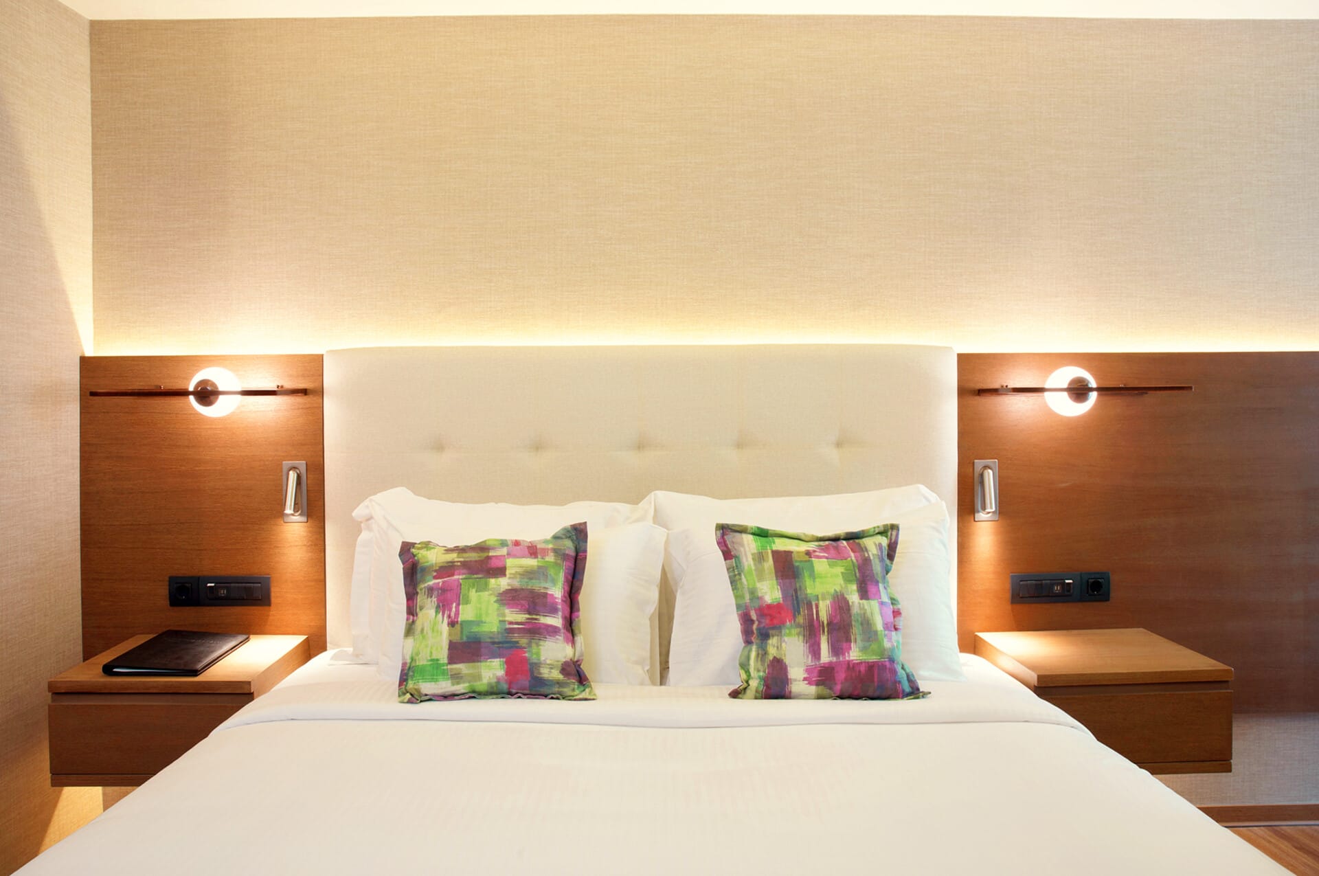 a bed with a white bed spread