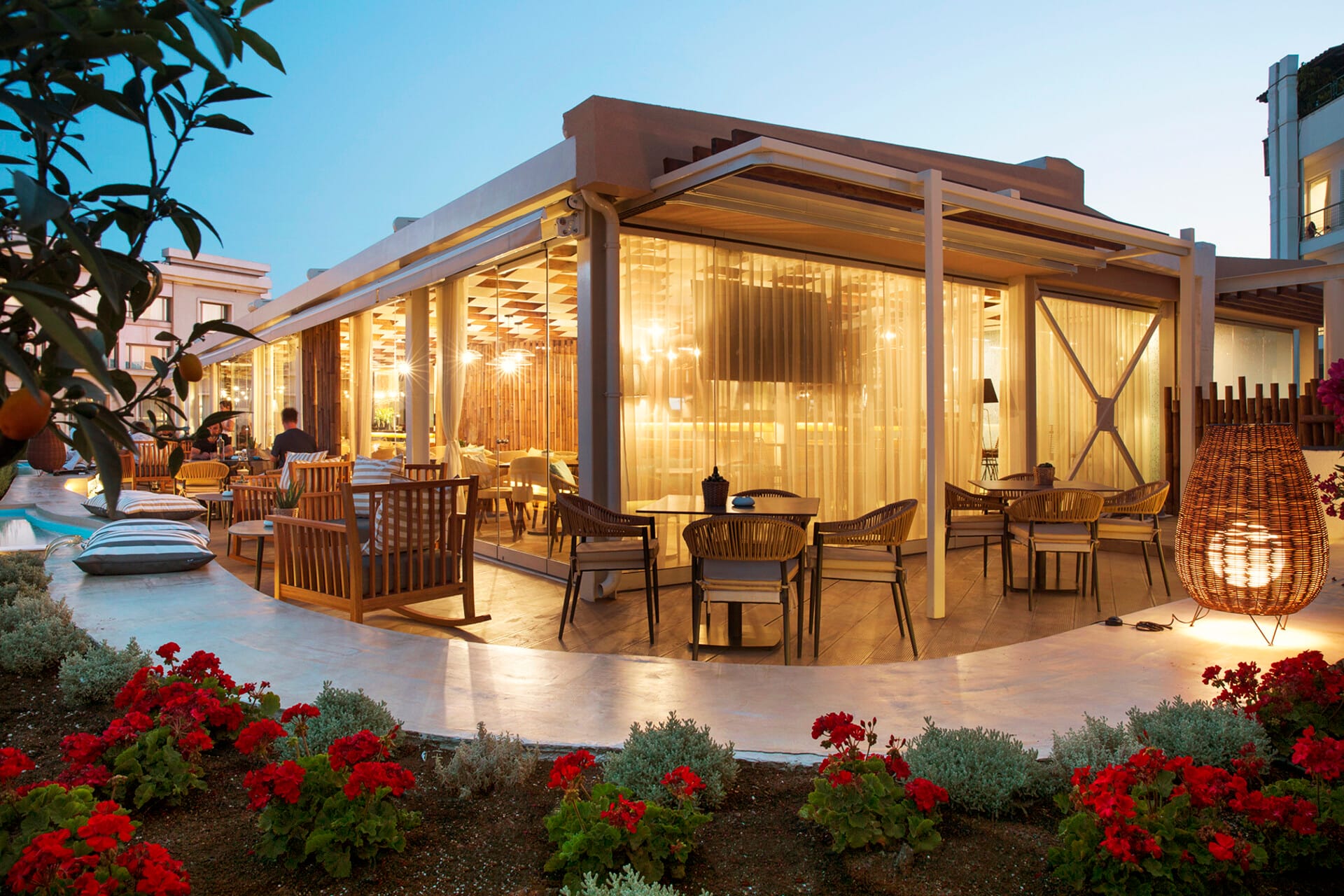 a house with a pool and chairs