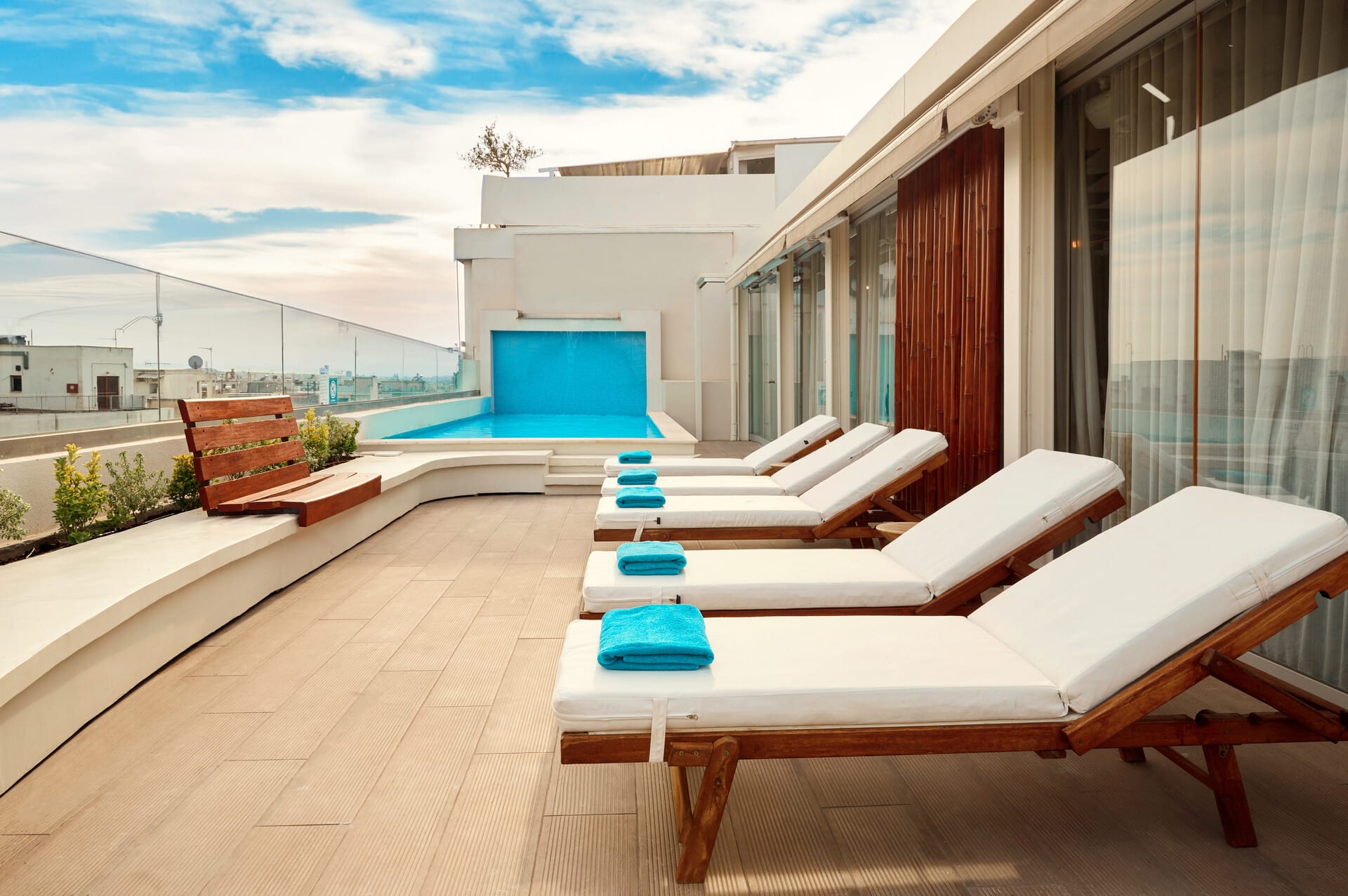 a room with a couch and chairs