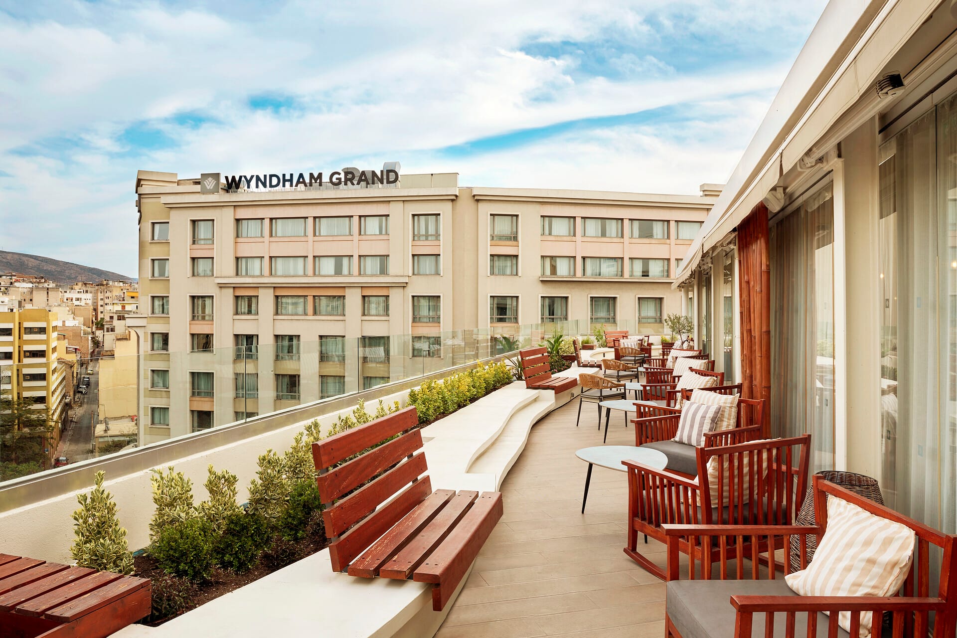 a patio with chairs and tables outside