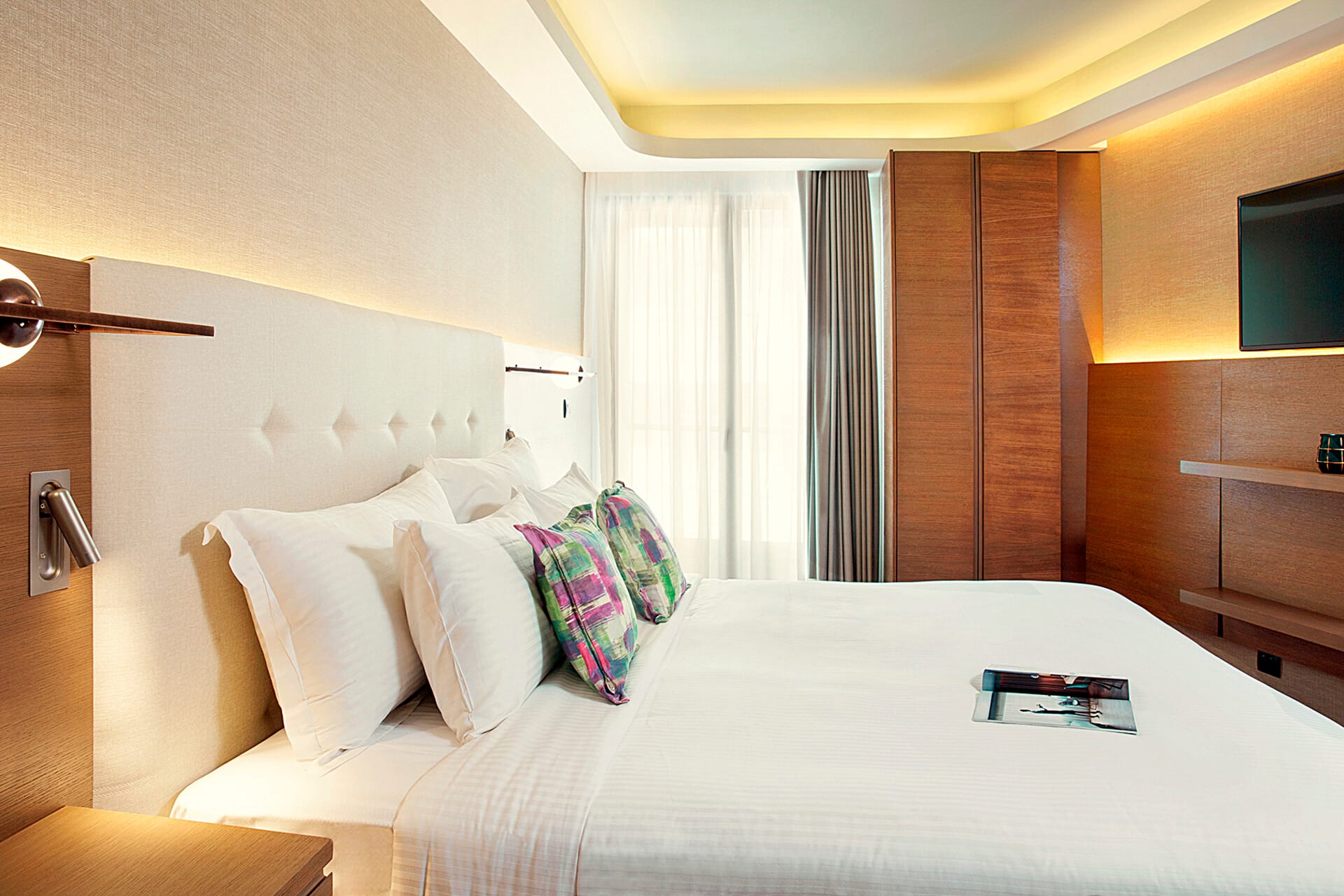 a bed with a white bed spread