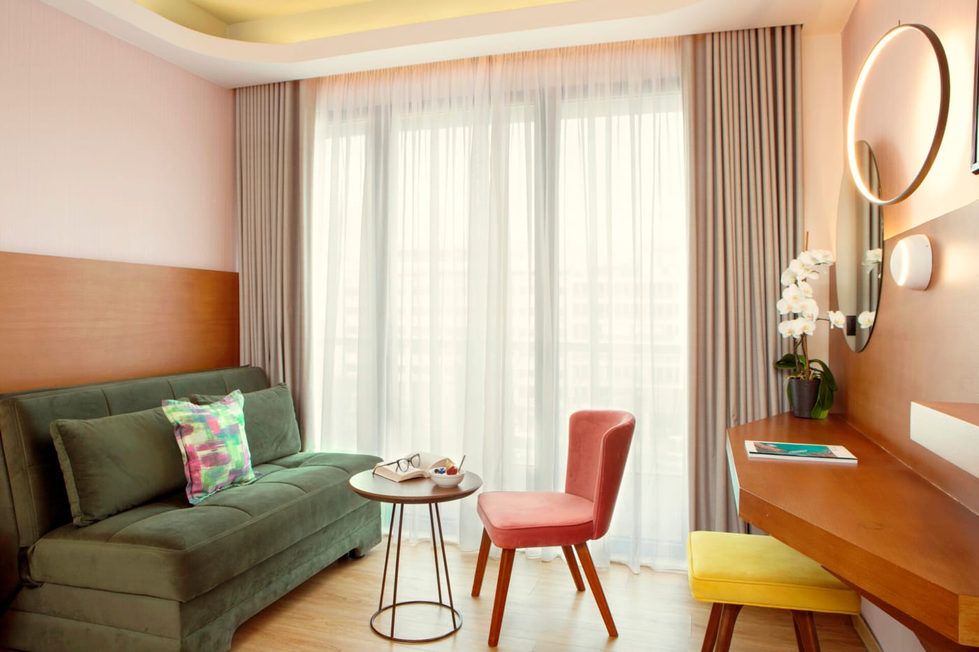 a living room with a green couch and a table