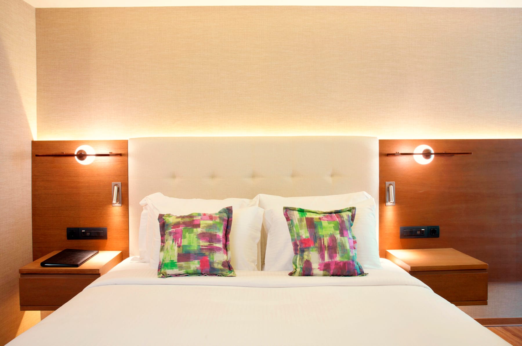 a bed with a white bed spread