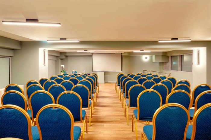 a room with blue chairs