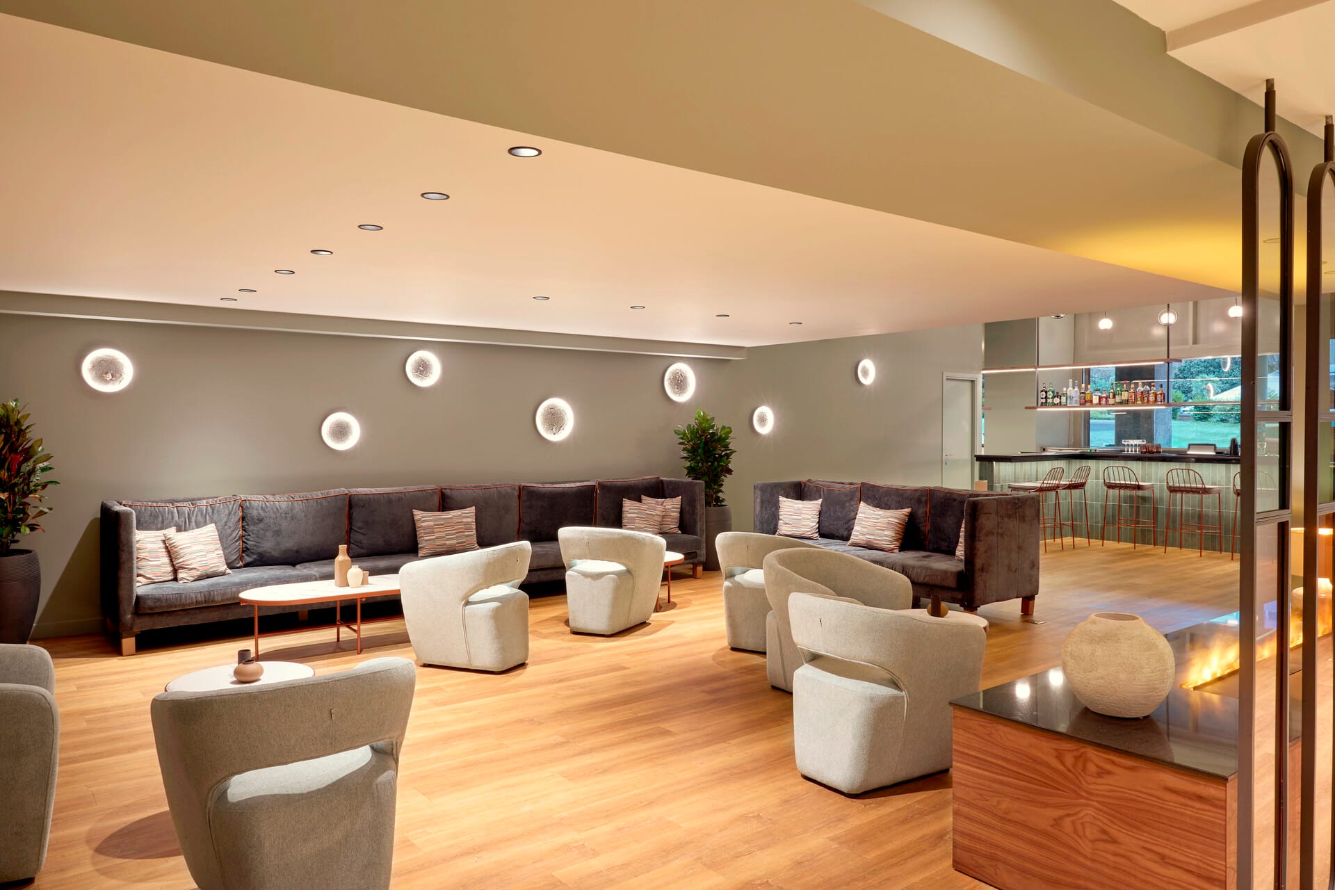 a room with a couch and chairs