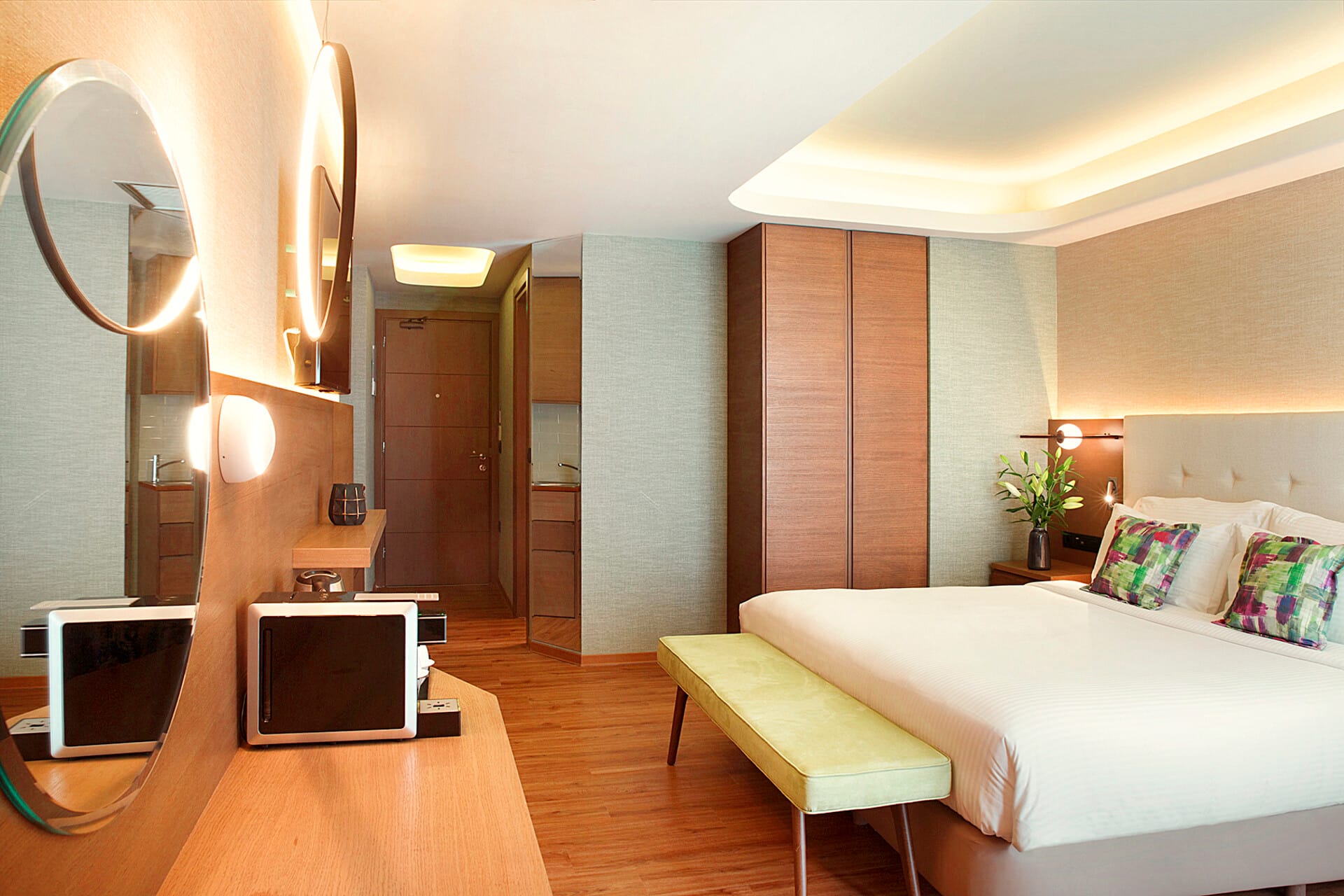 a bedroom with a bed and a television