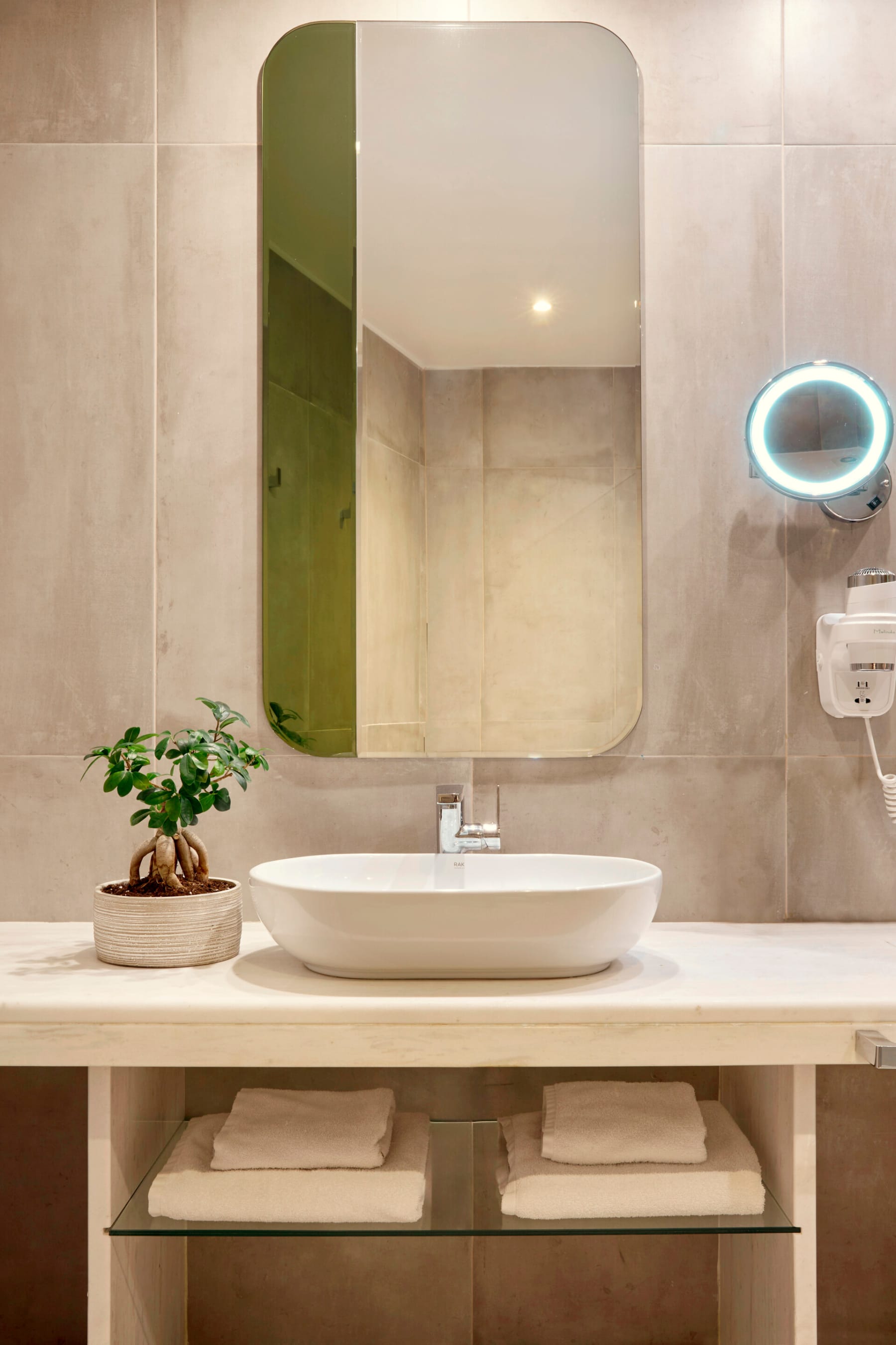 a bathroom with a large mirror