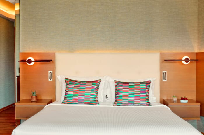 a bed with a white bed spread