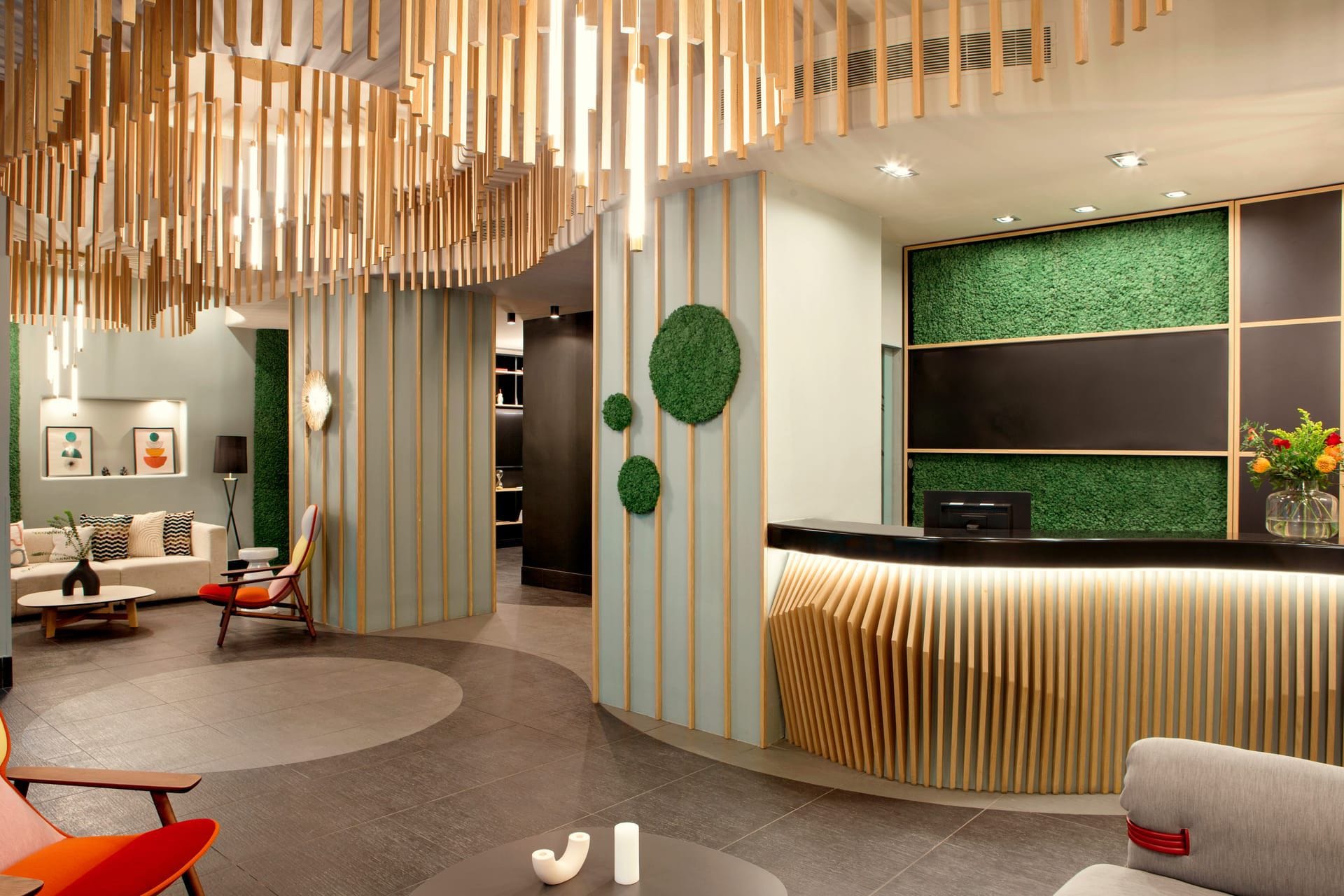 a room with a large screen and chairs