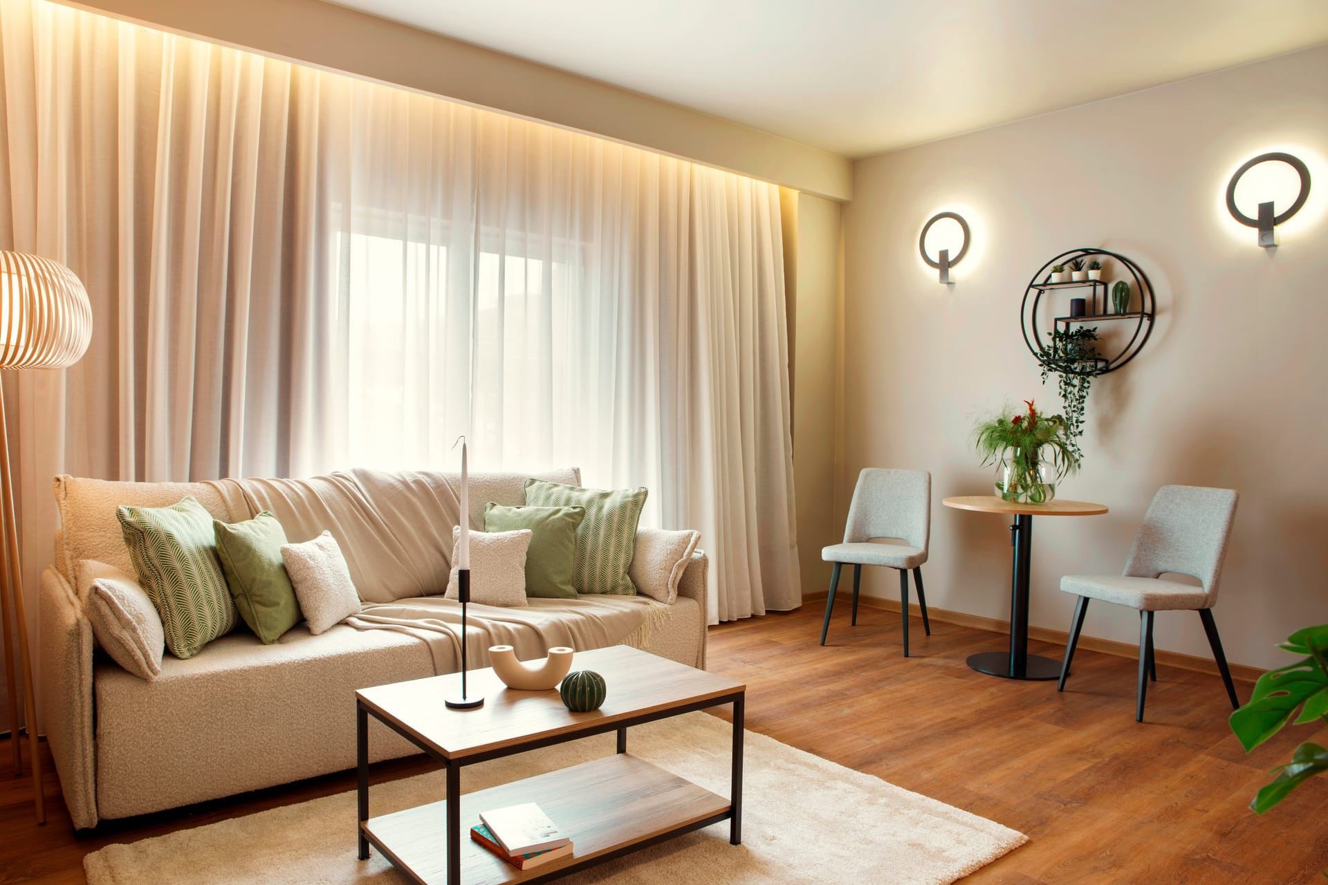 a living room with a couch and chairs