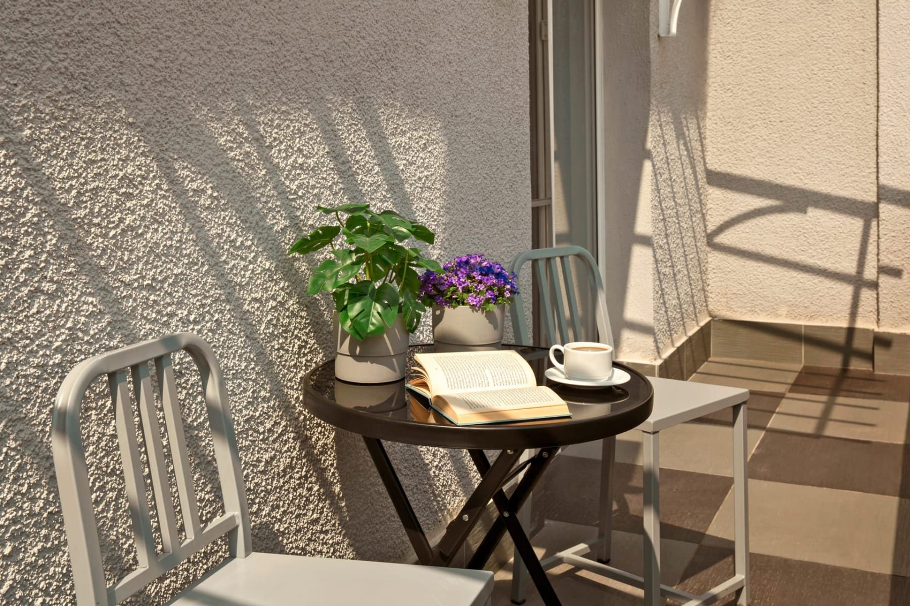 a table with a book and flowers on it
