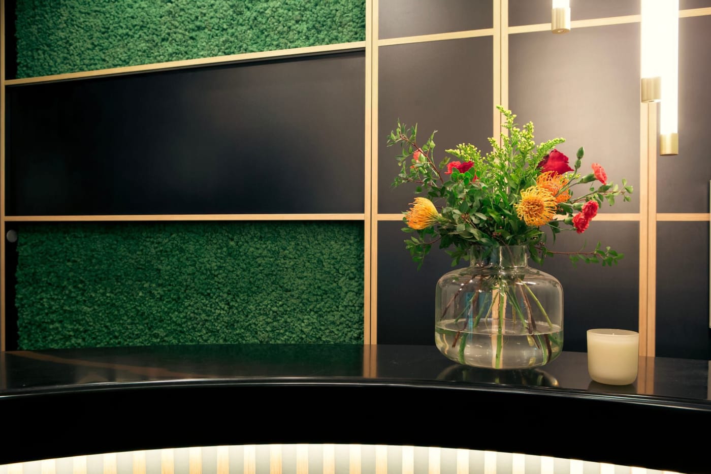 a vase of flowers on a counter