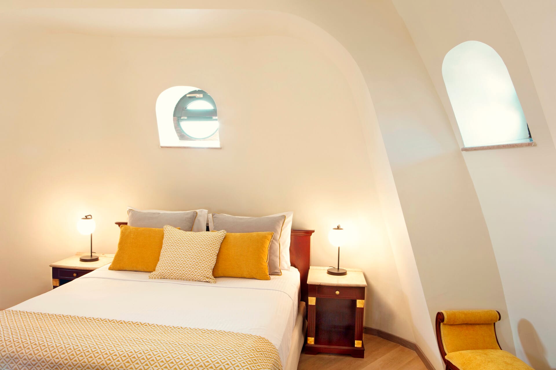 a bed with a lamp on the side