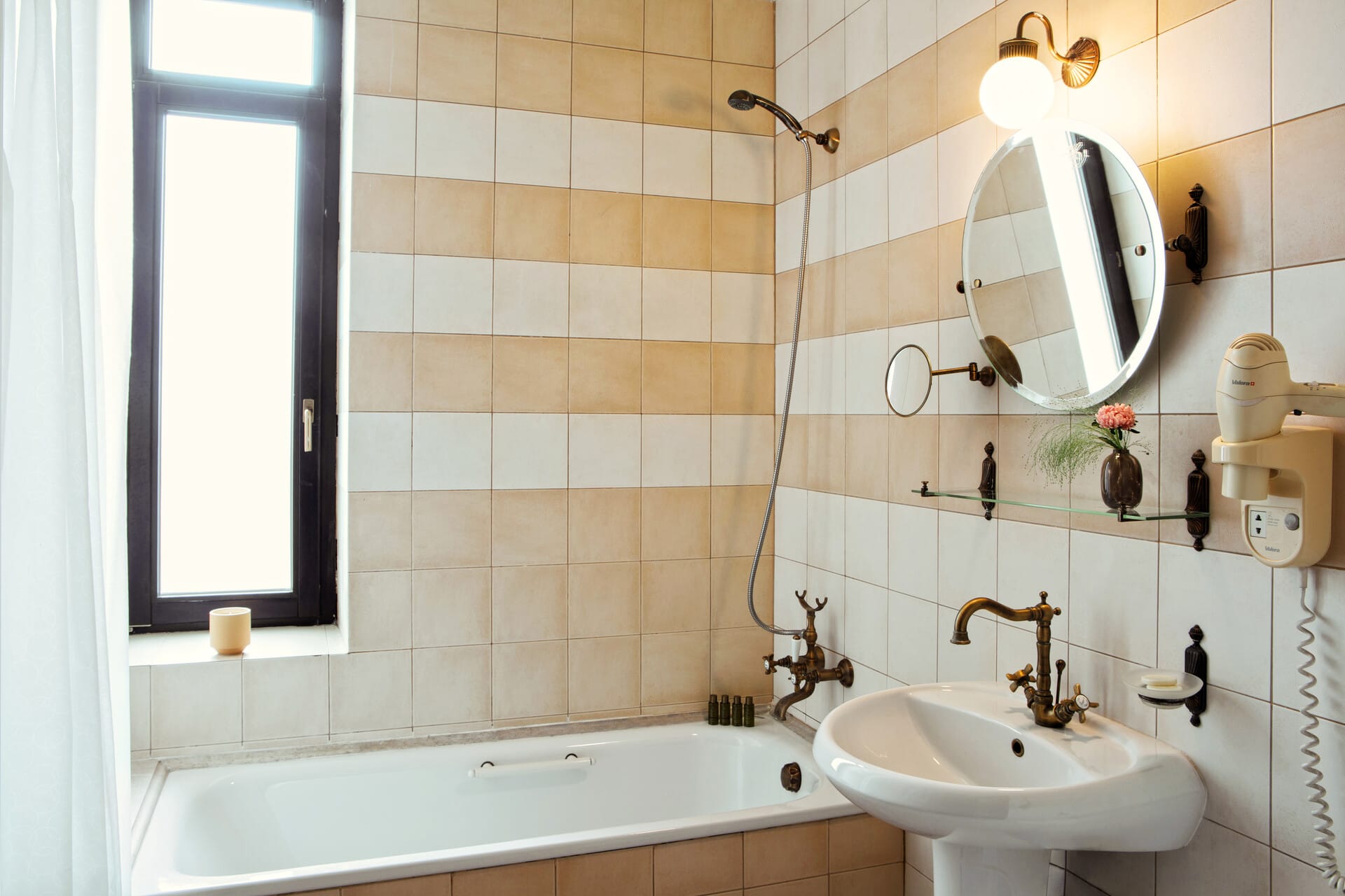 a bathroom with a mirror and sink