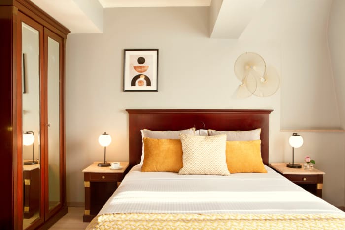a bed with a white bed spread