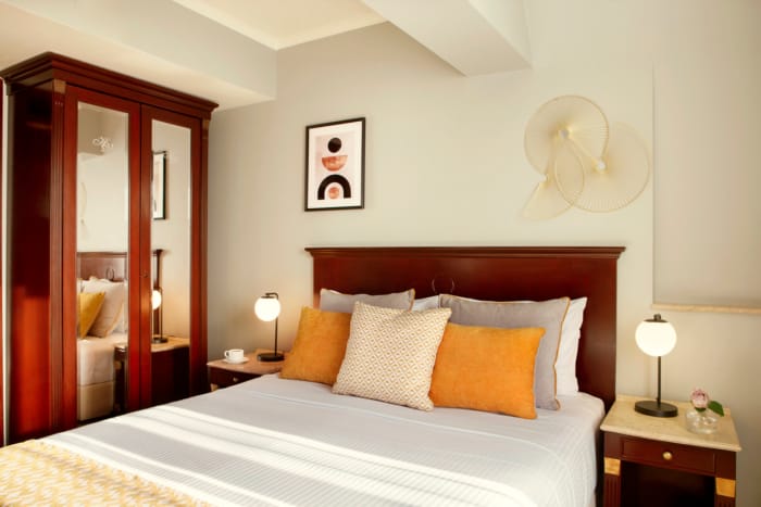 a bed with a white bed spread