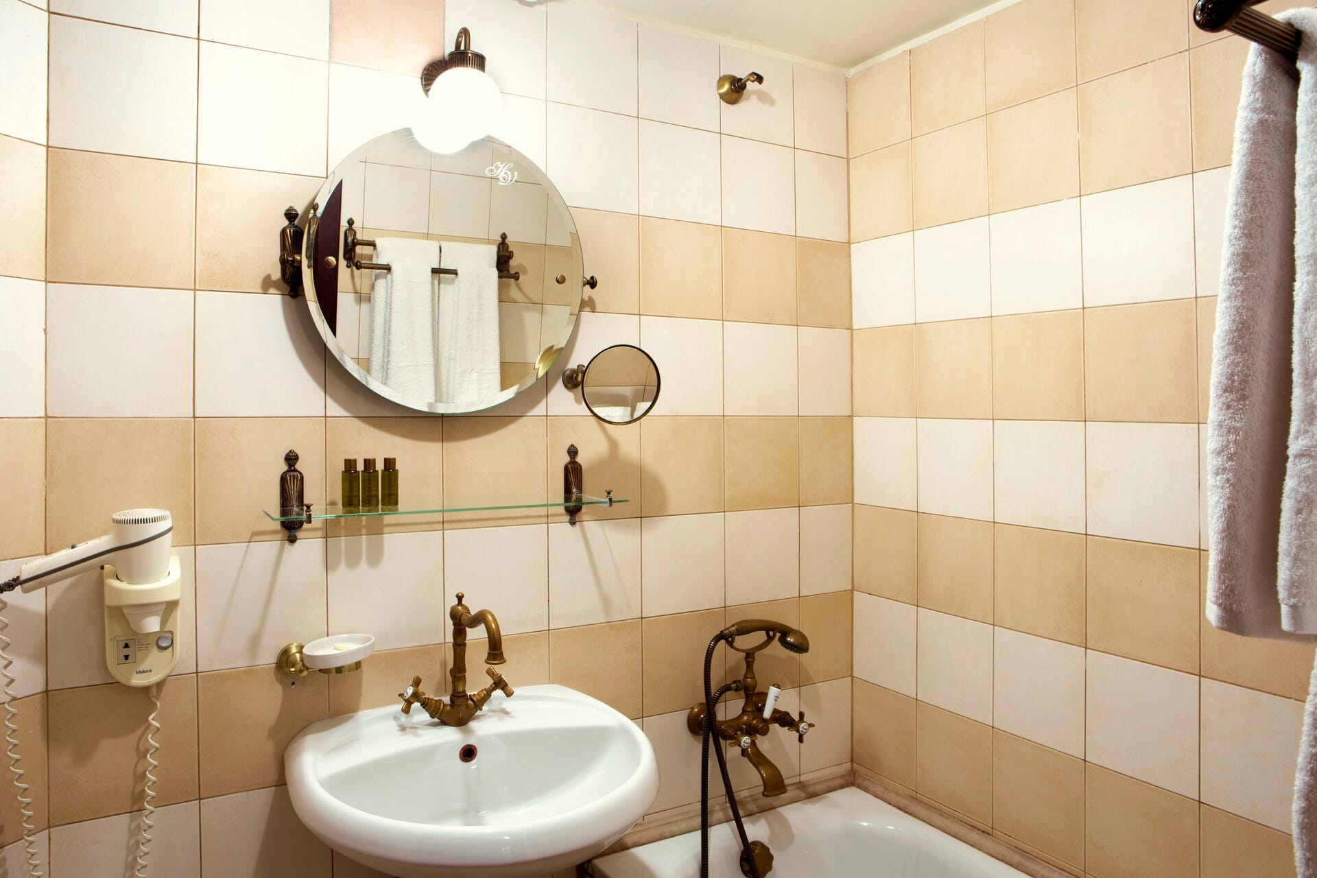 a bathroom with a mirror and sink