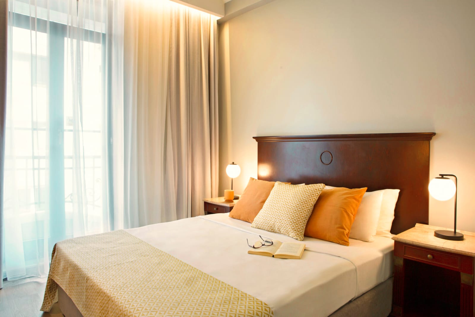 a bed with a white bed spread